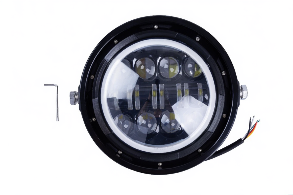 Round LED headlight with black casing on a white background