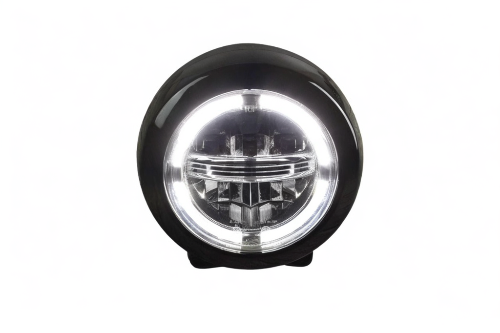 Round black light fixture with clear lens on a white background