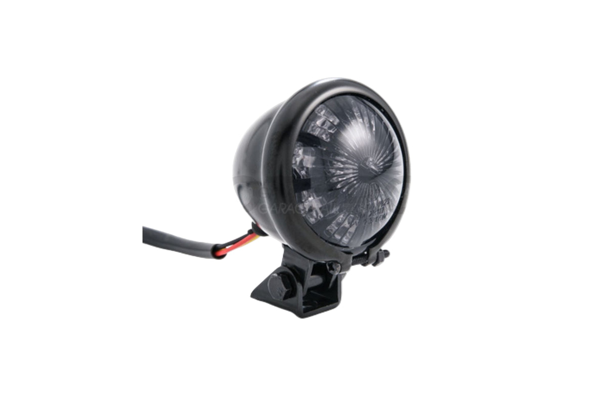 Black LED tail light with a chrome bezel, mounted on a motorcycle to show fit and style.