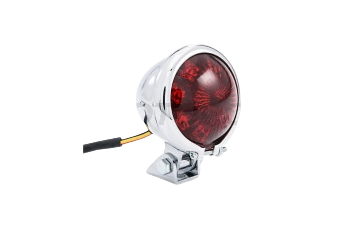 Black LED tail light with a chrome bezel, mounted on a motorcycle to show fit and style.